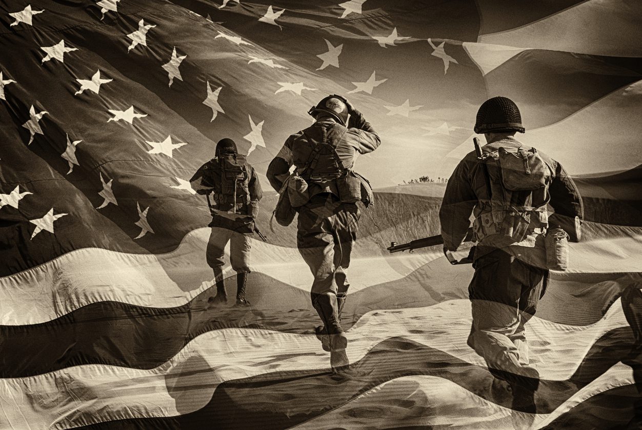 Three Active Duty American Soldiers Running Through a horizontal image of a field of stars and stripes.  Battle ready and running.  Sepia Toned.  Grain.  I have a color image if asked.  Composite Image.